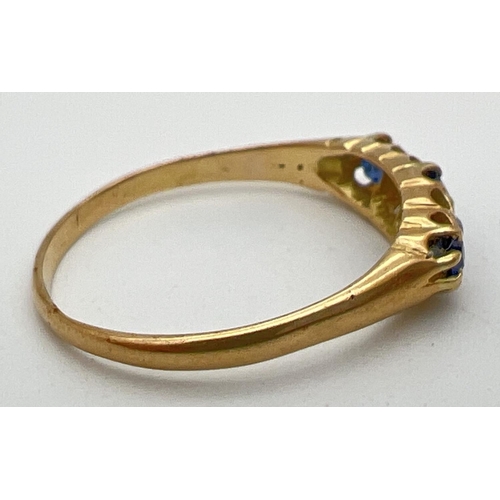 1003 - A vintage gypsy style 18ct gold sapphire and diamond set ring. Claw set mount with 3 sapphires and t... 