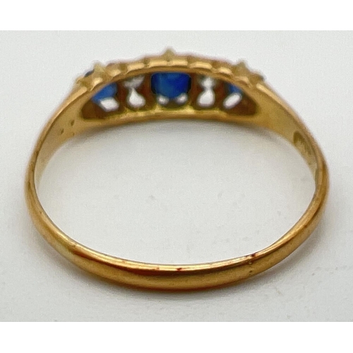 1003 - A vintage gypsy style 18ct gold sapphire and diamond set ring. Claw set mount with 3 sapphires and t... 