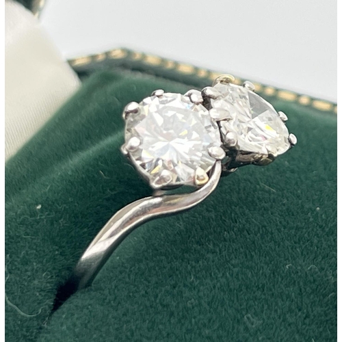 1006 - A vintage platinum and 2.8ct diamond twist design ring. 2 round brilliant cut diamonds, vendor advis... 