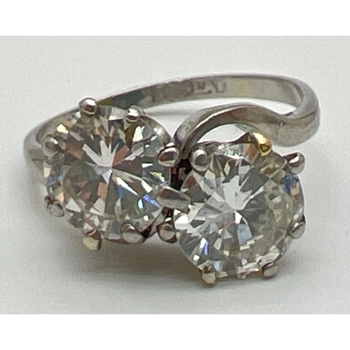 1006 - A vintage platinum and 2.8ct diamond twist design ring. 2 round brilliant cut diamonds, vendor advis... 