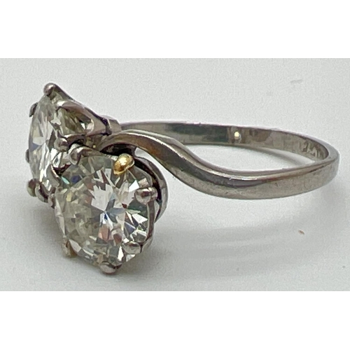 1006 - A vintage platinum and 2.8ct diamond twist design ring. 2 round brilliant cut diamonds, vendor advis... 