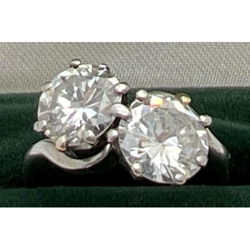 1006 - A vintage platinum and 2.8ct diamond twist design ring. 2 round brilliant cut diamonds, vendor advis... 