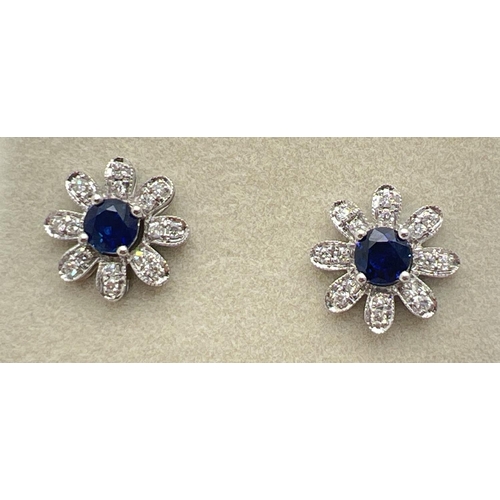 1008 - A pair of 18ct white gold, diamond and sapphire 2 in 1 adjustable flower design stud style earrings ... 