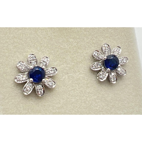 1008 - A pair of 18ct white gold, diamond and sapphire 2 in 1 adjustable flower design stud style earrings ... 