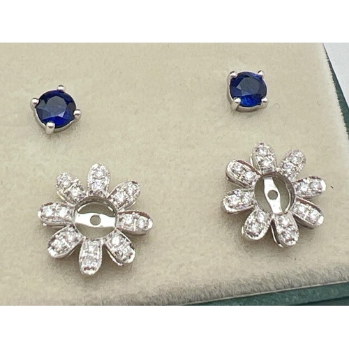 1008 - A pair of 18ct white gold, diamond and sapphire 2 in 1 adjustable flower design stud style earrings ... 