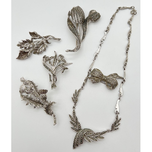 1022 - A small quantity of assorted vintage marcasite set costume jewellery. Comprising 5 brooches and a ne... 