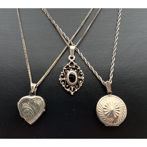 1024 - 3 silver necklaces. A vintage circular locket with sun-ray detail to front, a heart shaped locket wi... 