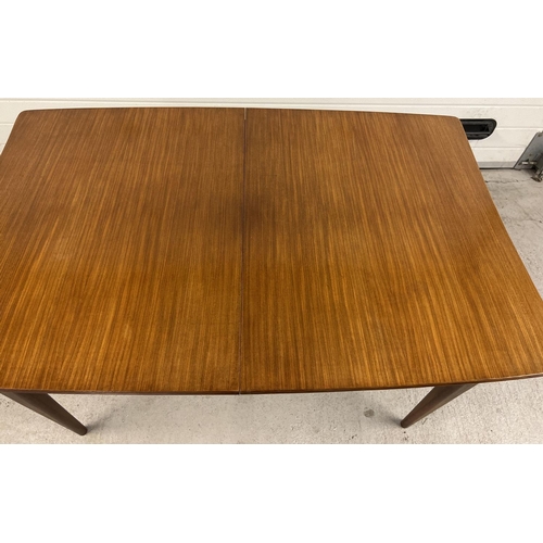 1388 - A mid century Afrormosia wood draw leaf extending dining table & 6 chairs, by Richard Hornby for Hea... 