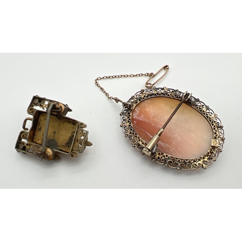 1026 - 2 antique cameo brooches. An oval cameo in a pierced work mount with safety chain, marked 830 to bac... 