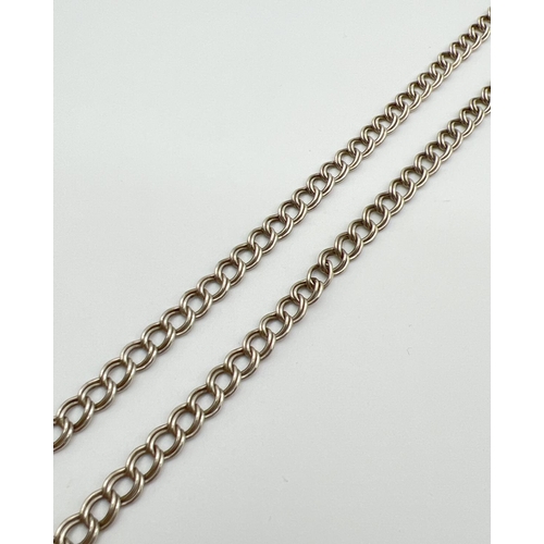 1031 - An 18 inch silver double belcher chain with spring ring clasp. Silver marks to clasp and fixings. To... 