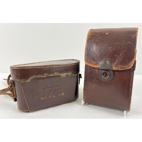 1303 - 2 vintage Zeis Ikon cameras in original brown leather cases & concertina fold-out lenses. A Zeiss Ik... 