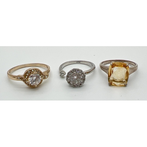 1033 - 3 stone set dress rings to include cocktail style ring set with a single square set lemon quartz sto... 