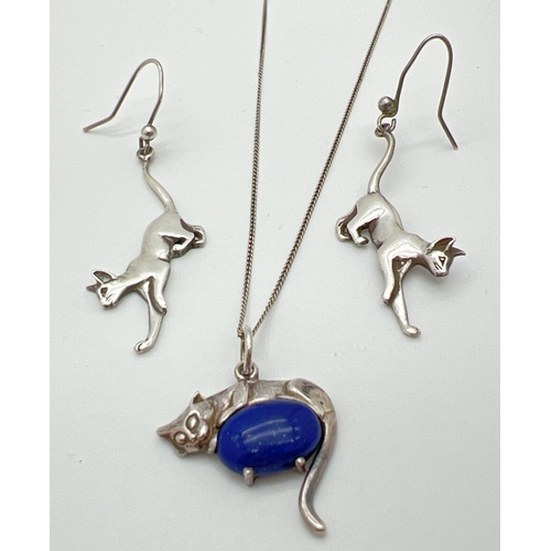 1043 - A pair of white metal cat shaped, drop style earrings together with a cat pendant set with a blue st... 