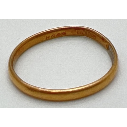 1048 - A vintage 22ct gold thin wedding band (slightly mis-shaped). Hallmarks to inside of band. Total weig... 