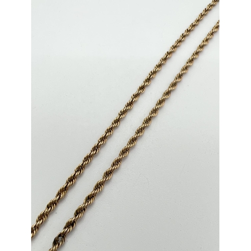 1053 - A 9ct gold 16 inch rope chain with spring ring clasp. Gold marks to clasp and fixings. Total weight ... 