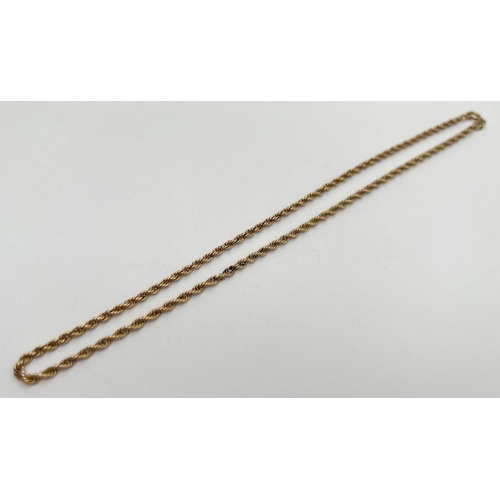 1053 - A 9ct gold 16 inch rope chain with spring ring clasp. Gold marks to clasp and fixings. Total weight ... 