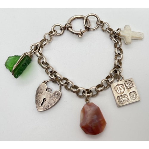 1066 - A belcher chain style charm bracelet with large spring clasp and 5 charms. Charms include a padlock,... 