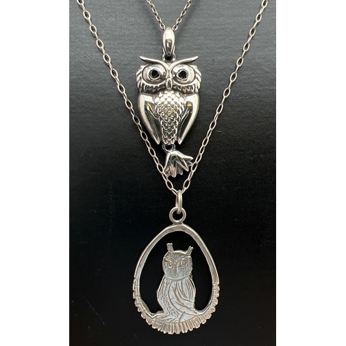 1067 - 2 vintage silver owl pendants on silver chains. An open work design sitting owl on a 29