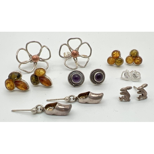 1069 - 7 pairs of silver and white metal stud and drop style earrings for pierced ears. To include amber se... 