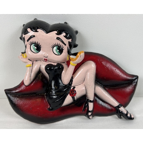 1223 - A painted cast iron Betty Boop wall plaque. Approx. 15cm x 19cm.