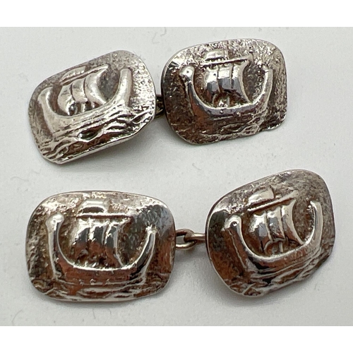 1077 - A pair of vintage silver cuff links with Viking Ship decoration. Silver marks to backs. Total weight... 