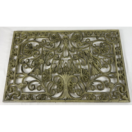 1225 - A rectangular shaped cast iron door mat with pierced floral design & 6 rubber supports to underside.... 