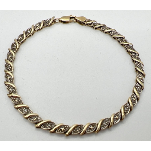 1080 - A 7.5 inch 9ct gold and diamond decorative bracelet. 30 small wave design panels, 15 set with a smal... 