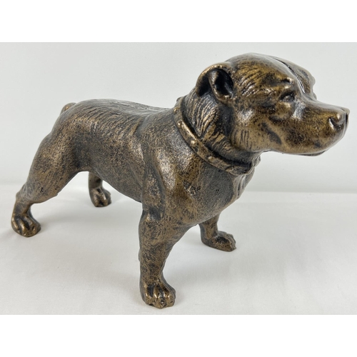 1226 - A bronzed effect painted cast iron figure of a Pitbull dog. Approx. 19.5cm x 31.5cm and weighs 5kg.