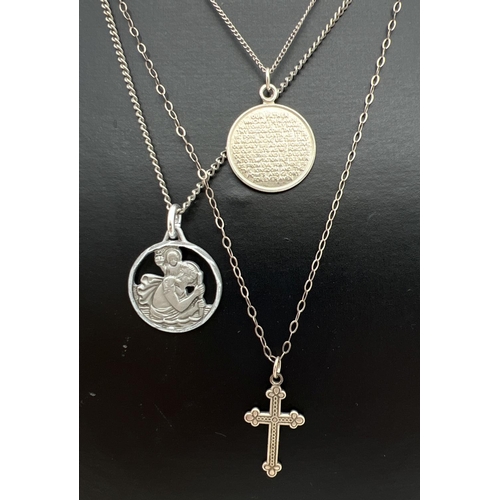 1089 - 3 silver and white metal necklaces. A small cross with engraved pattern to front, on an 18