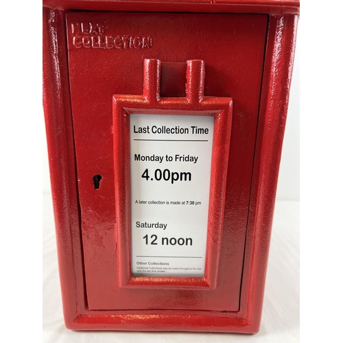 1227 - A full sized, red painted, cast metal GR post box with gold painted detail. Complete with keys. Appr... 