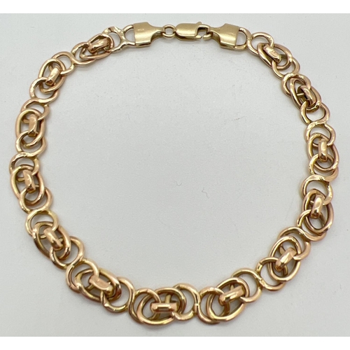 1097 - A 9ct gold 8 inch decorative link bracelet with lobster style clasp. Gold marks to clasp and fixings... 