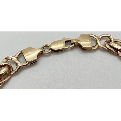 1097 - A 9ct gold 8 inch decorative link bracelet with lobster style clasp. Gold marks to clasp and fixings... 