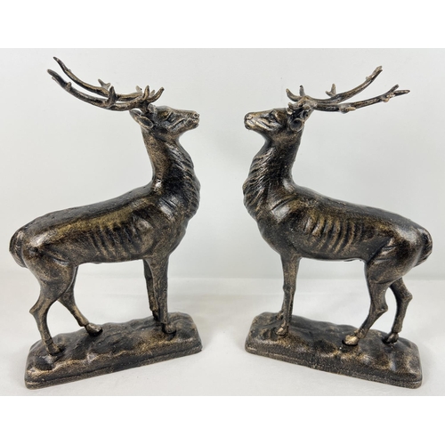 1230 - A pair of cast iron bronzed effect stag figures, approx 29.5cm tall.