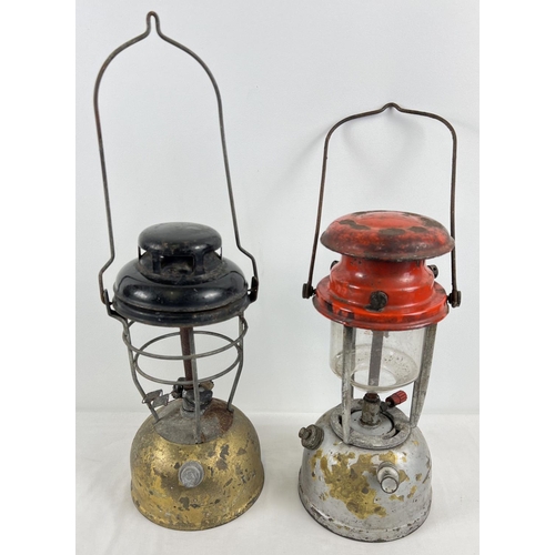 1235 - 2 vintage paraffin lamps, to include a Bialaddin lamp comlete with glass, in red and silver.