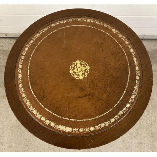 1390 - A vintage dark wood drum topped occasional table with tan coloured leather insert to top. Gilt detai... 