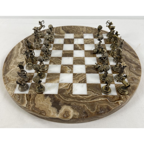 1344 - A vintage circular shaped marble chess board with cast metal Greek Mythology chess pieces (2 a/f). B... 