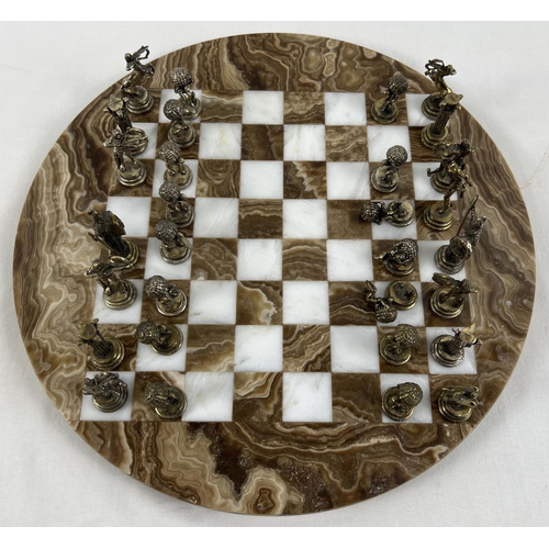 1344 - A vintage circular shaped marble chess board with cast metal Greek Mythology chess pieces (2 a/f). B... 