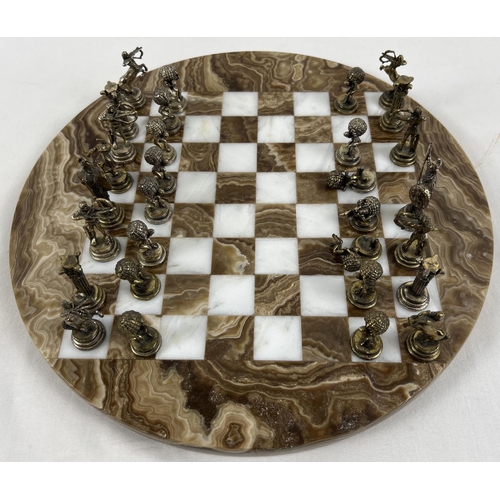 1344 - A vintage circular shaped marble chess board with cast metal Greek Mythology chess pieces (2 a/f). B... 