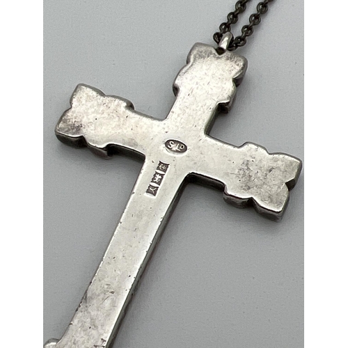 1117 - A large vintage heavy silver cross shaped pendant with floral engraved decoration to front. On a 22