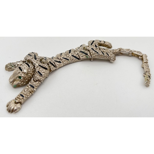 1127 - A large vintage articulated silver tone brooch of a tiger. Made from 20 separate moving panels with ... 