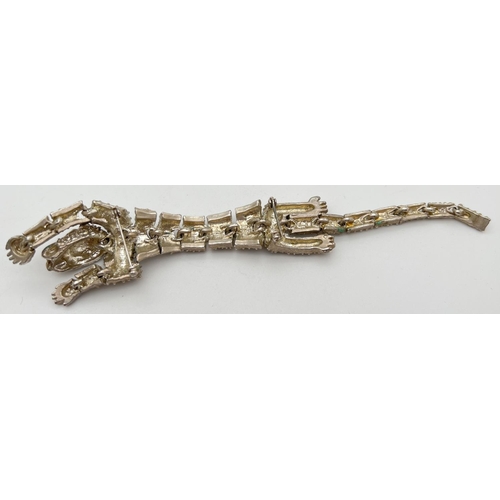 1127 - A large vintage articulated silver tone brooch of a tiger. Made from 20 separate moving panels with ... 