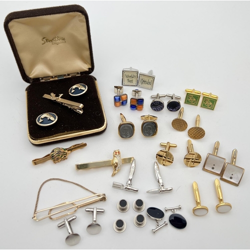 1128 - A collection of vintage and modern cufflinks and tie pins to include a boxed matching set with fish ... 