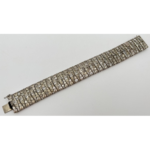 1136 - A vintage Art Deco style geometric pattern diamante bracelet with push clasp and safety clip. Total ... 