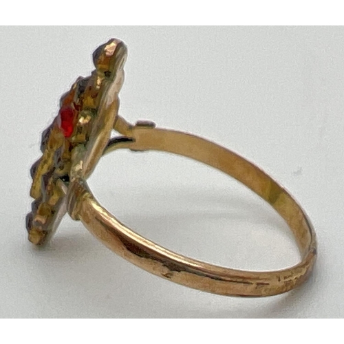 1138 - A vintage garnet dress ring with marquise shaped mount set with small round cut garnets. Ring shows ... 