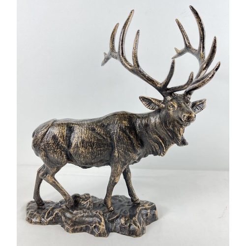 1242 - A large bronzed effect cast iron figure of a stag. Approx. 43cm tall and weighs 6.5kg.