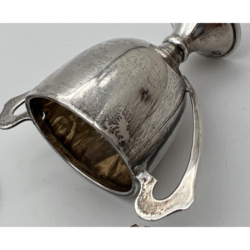 1206 - 3 silver items. A small sliding pencil with small turquoise glass cabochon, a small trophy cup witho... 