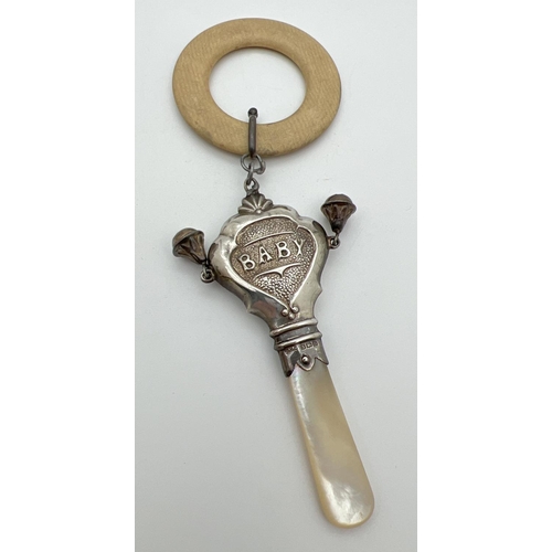 1207 - A vintage silver baby's rattle/teething ring with two small bells and mother of pearl handle. Hallma... 