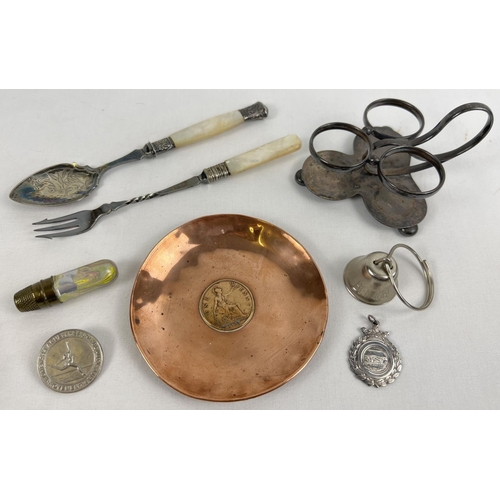 1208 - A small collection of silver plate and metalware. To include a silver plated cruet stand, mother of ... 