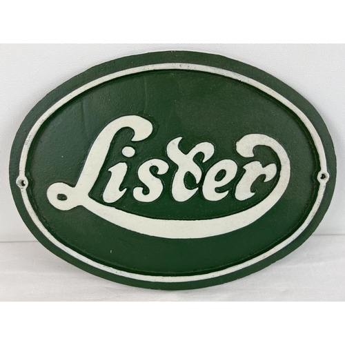 1335 - A green & white painted oval shaped cast iron wall plaque for Lister engines. With fixing holes. App... 