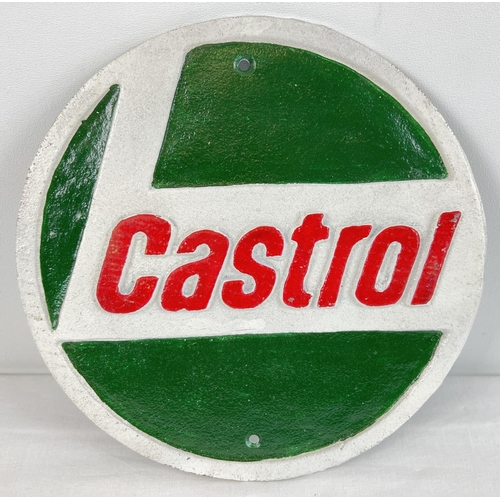 1337 - A circular shaped painted cast iron wall plaque for Castrol Oils. In green, white & red, with fixing... 